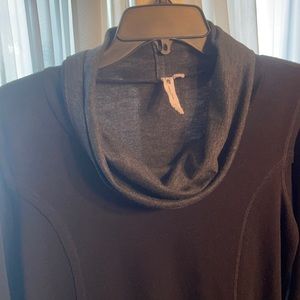 Cable & Gauge black tunic trimmed with gray around the collar and end of sleeves